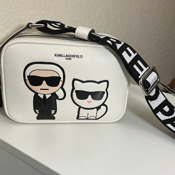 Karl Lagerfeld Handbags - Karl Lagerfeld Paris White Camera Bag with Cat Graphic & Guitar Strap